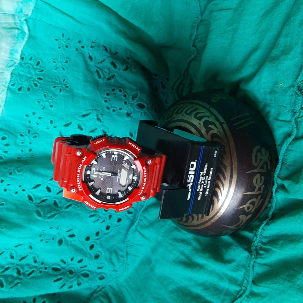 Casio solar powered watch red in color